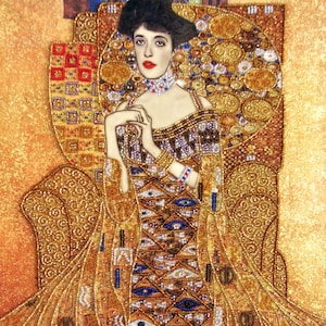 May include: A painting of a woman in a gold and blue dress with a beaded design. The woman is sitting in a chair with a gold background. The painting is in the style of Gustav Klimt.