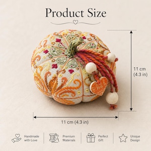 Size reference infographic for the Pumpkin Heart of Autumn pincushion sampler cross stitch kit. The finished pumpkin pincushion measures 11 × 11 cm (4.3 × 4.3 inches). Decorative embroidery, ceramic stem, heart charm, and dimensional construction are shown clearly to help buyers understand the finished project size.