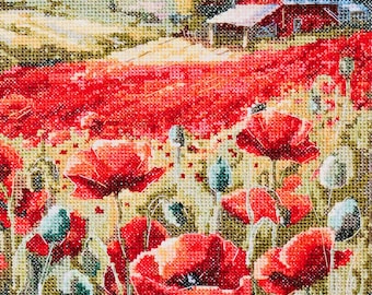 May include: A cross-stitch landscape featuring a vibrant field of red poppies in full bloom. A red barn with a gray roof sits on a hill in the background, with mountains and trees in the distance. The artwork is detailed and colorful.