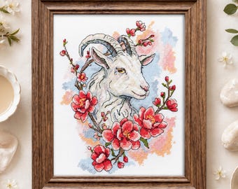 May include: A cross-stitch embroidery of a white goat head surrounded by red flowers and branches, set against a soft watercolour-style background of blue and orange hues. The artwork is displayed in a rectangular brown wooden frame.