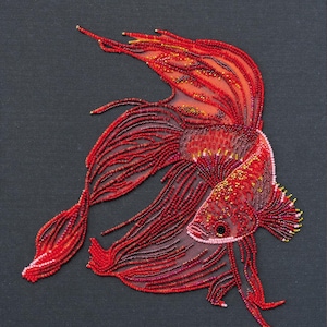 May include: Red Gold, a beaded artwork depicting a red betta fish with a long flowing tail. The fish is 27x39 cm (10.6x15 in).
