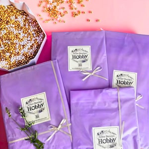Beautifully wrapped embroidery kits prepared for shipping. Gift-ready packaging demonstrates careful presentation and secure delivery, making the pumpkin pincushion sampler kit a thoughtful gift for stitchers, crafters, and embroidery enthusiasts.