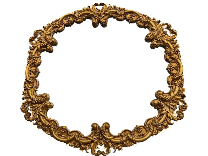 May include: Ornate gold-colored oval frame with intricate floral and scrollwork detailing. The frame has a classic, vintage aesthetic, perfect for displaying artwork or photographs. The design features a symmetrical arrangement of decorative elements.