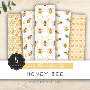 May include: Five printable bookmarks featuring a honey bee theme. The bookmarks have different patterns, including honeycombs, bees, and leaves. The text "5 pieces printable bookmarks HONEY BEE COMMERCIAL USE" is printed on the bottom of the image.