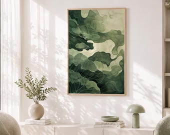 May include: Abstract art print featuring a watercolor design in shades of green. The artwork, framed in a light wood, showcases organic shapes and delicate line details. The print hangs on a white wall, complementing the neutral tones of the room's decor.