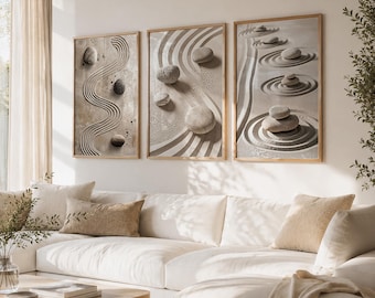May include: Three framed wall art pieces depicting zen garden designs. Each piece features a different arrangement of stones and raked sand patterns in neutral tones. The frames are a light wood color, and the overall aesthetic is minimalist and calming.