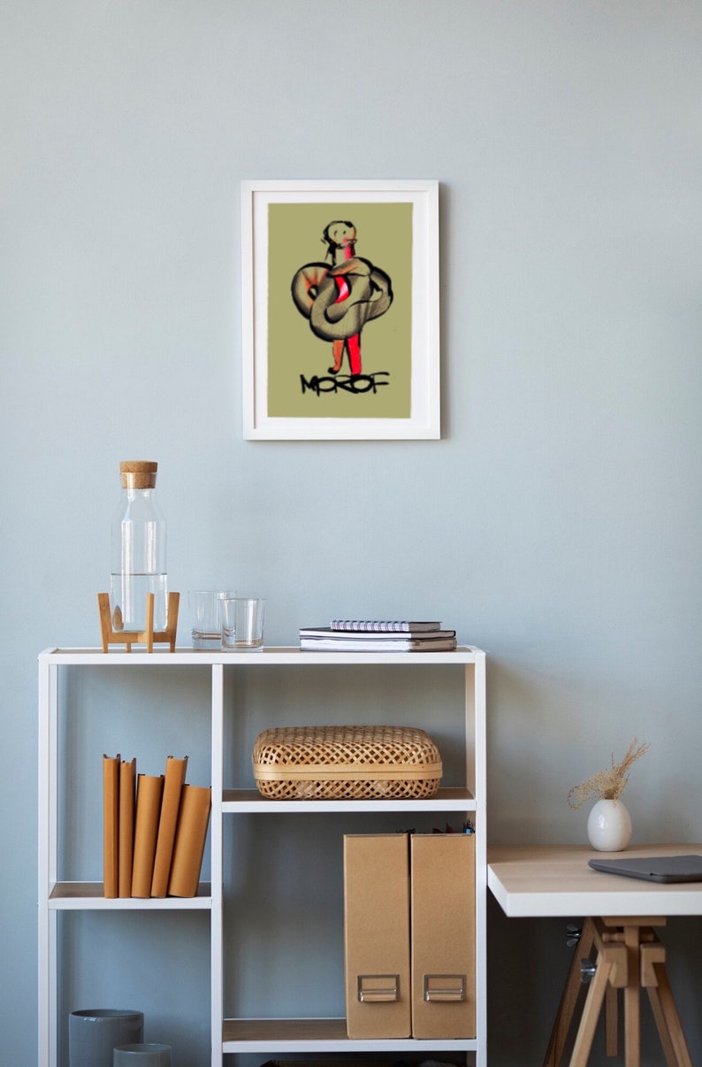 May include: A white framed print of a digital illustration of a person in a green and red outfit with the word "MOFOF" written below the figure.