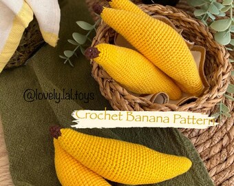 May include: Crocheted banana pattern. Three yellow crocheted bananas in a woven basket. Two more yellow crocheted bananas on a green fabric surface. The text "Crochet Banana Pattern" is visible in the image.