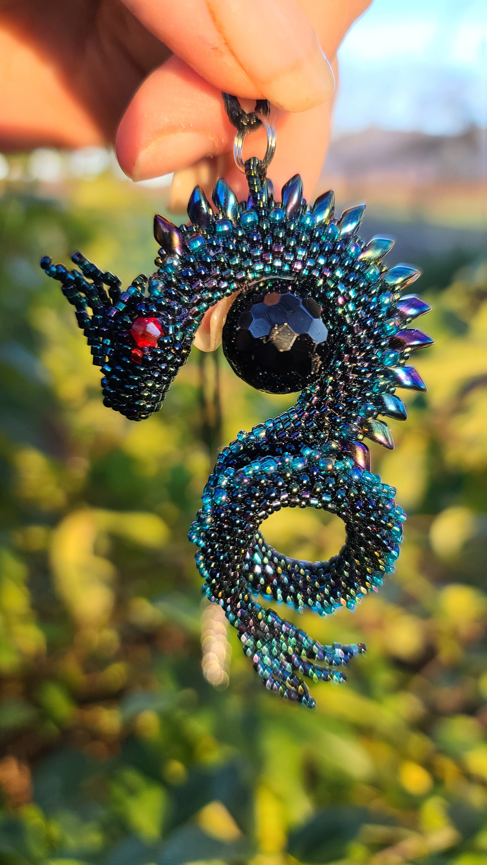 Rainbow black dragon on faceted black tourmaline bead