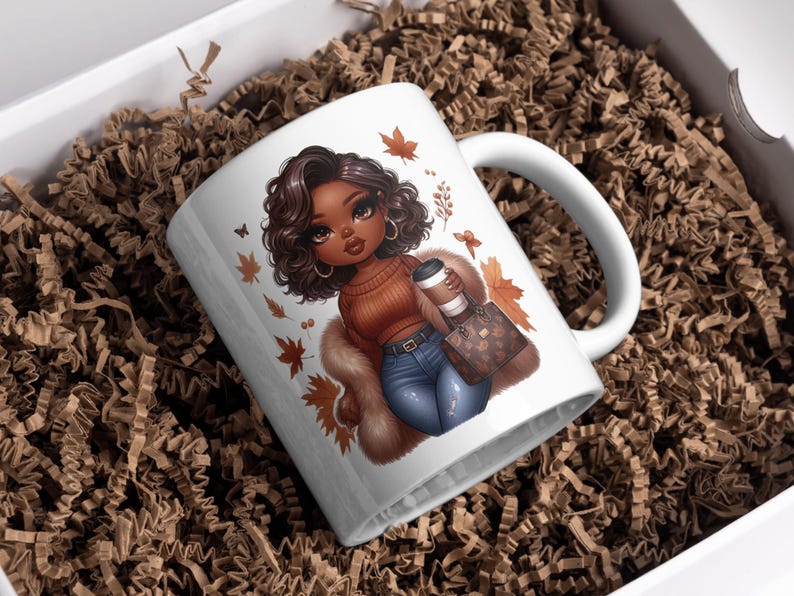 May include: White ceramic mug with a colorful illustration of a woman with brown hair and brown eyes wearing a brown sweater, blue jeans, and a fur coat. She is holding a coffee cup and a brown purse with gold accents. The mug has a brown handle and is surrounded by fall leaves.