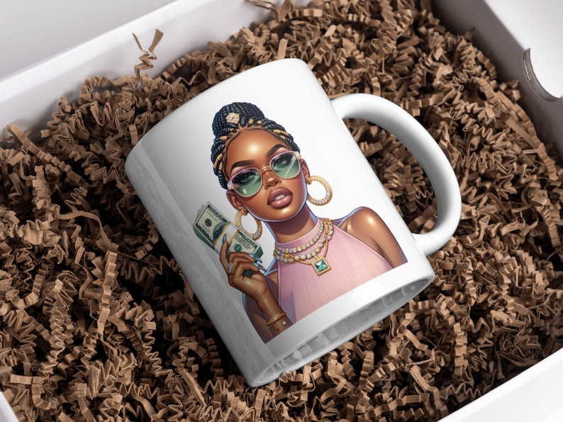 May include: White ceramic mug with a colorful illustration of a woman wearing sunglasses and holding cash. She is wearing a pink top and gold jewelry.