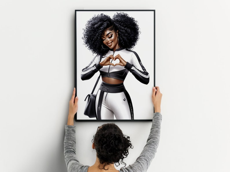 May include: A framed illustration of a woman with dark curly hair wearing a white and black athletic outfit. She is making a heart shape with her hands. The background is white.
