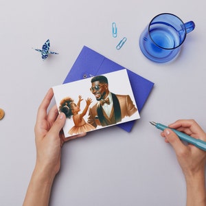 May include: A card with a drawing of a father and daughter. The father is wearing a brown suit and a bow tie. The daughter is wearing a white dress. The father is looking at the daughter and smiling. The daughter is looking at a butterfly.
