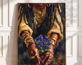 May include: A framed wall art print featuring a painting of dark-skinned hands with bright pink nails planting a cluster of purple violets in dark soil. The figure wears a yellow shirt, gold hoop earrings, a gold chain necklace, and multiple gold bracelets.