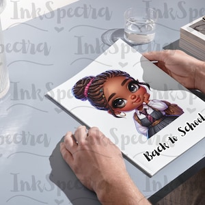 May include: A white notebook with a cartoon illustration of a young girl with brown skin, brown hair, and a blue and white school uniform. The text "Back to School" is printed in black on the notebook.
