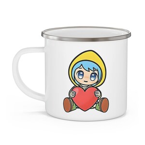 May include: White enamel mug with a cartoon illustration of a girl with blue hair wearing a yellow raincoat and holding a red heart.