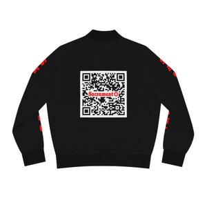 May include: Black bomber jacket with red accents and a QR code on the back that says "Sacrament".