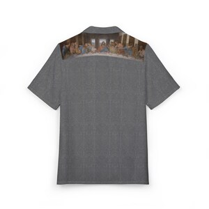 May include: A grey short-sleeved button-down shirt with a print of Leonardo da Vinci's The Last Supper on the back.