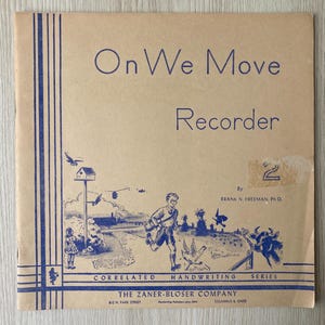 May include: Vintage "On We Move Recorder" book cover. The cover is tan with blue text and illustrations of a boy running, birds, and farm animals. The text includes "CORRELATED HANDWRITING SERIES" and "THE ZANER-BLOSER COMPANY".