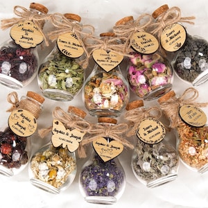 Wedding Tea Favors For Guests, Rustic Wedding Favors, Herbal Tea Favors, Loose Leaf Tea, Tea Party Favor, Bridal Shower, Wedding Guest Gifts

Delight your guests with these charming Wedding Tea Favors — a perfect blend of elegance and nature. Each favor includes a clear glass jar filled with aromatic loose-leaf herbal tea, topped with a natural cork lid and adorned with a rustic twine bow and a personalized wooden tag.