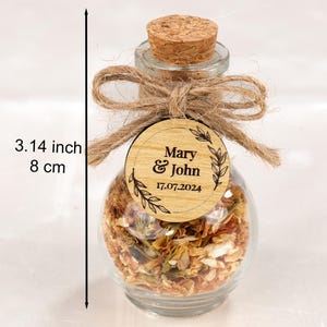 Wedding Tea Favors For Guests, Rustic Wedding Favors, Herbal Tea Favors, Loose Leaf Tea, Tea Party Favor, Bridal Shower, Wedding Guest Gifts

Delight your guests with these charming Wedding Tea Favors — a perfect blend of elegance and nature. Each favor includes a clear glass jar filled with aromatic loose-leaf herbal tea, topped with a natural cork lid and adorned with a rustic twine bow and a personalized wooden tag.