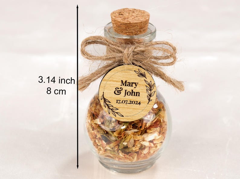 Wedding Tea Favors For Guests, Rustic Wedding Favors, Herbal Tea Favors, Loose Leaf Tea, Tea Party Favor, Bridal Shower, Wedding Guest Gifts

Delight your guests with these charming Wedding Tea Favors — a perfect blend of elegance and nature. Each favor includes a clear glass jar filled with aromatic loose-leaf herbal tea, topped with a natural cork lid and adorned with a rustic twine bow and a personalized wooden tag.