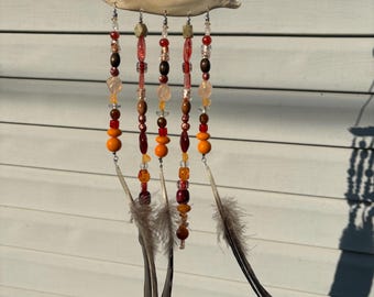 Coyote Jaw Sun Catcher With Feathers