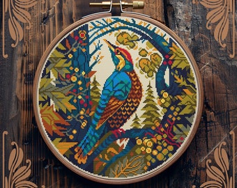 May include: Counted cross-stitch pattern of a colorful bird perched on a branch in a forest setting. The pattern is framed in a round wooden hoop.
