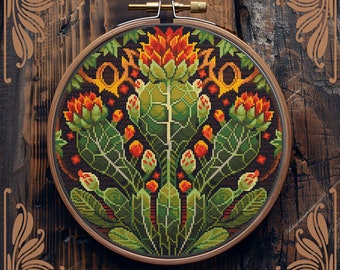 May include: A counted cross-stitch pattern in a wooden hoop. The design features a symmetrical floral pattern with orange, green, and red elements on a dark background. The text "Counted cross-stitch pattern by StitchingLand ©" is visible.