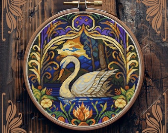 May include: Counted cross-stitch pattern of a white swan in a blue lake surrounded by colorful flowers and foliage. The pattern is in a round embroidery hoop.
