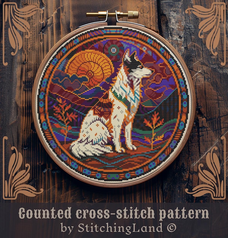 Peut inclure: Mod&egrave;le de point de croix compt&eacute; repr&eacute;sentant un loup blanc avec des marques brunes et noires, assis dans un paysage color&eacute; avec un coucher de soleil et des montagnes. Le motif est dans un cercle de broderie rond.