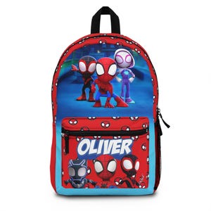 May include: Red and blue backpack featuring Spider-Man characters. The backpack has a large main compartment, a front zippered pocket, and a top handle. The front pocket has the name "OLIVER" printed in white. The backpack is designed for children.
