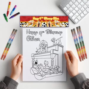 May include: A coloring page featuring Dalmatian puppies on a piano, with the text "Happy 4th Birthday Oliver." The image is held by hands, with colorful markers and a banner that reads "Happy 4th Birthday Oliver" at the top.