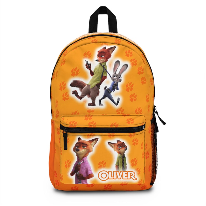 May include: Orange backpack featuring characters from the animated movie Zootopia. The backpack has a black handle and zipper, with a front pocket. The design includes images of Nick Wilde and Judy Hopps, along with paw prints and the name "Oliver".
