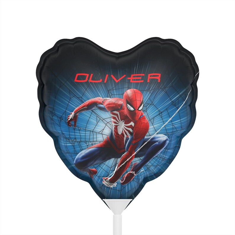 May include: Heart-shaped balloon featuring Spider-Man in a dynamic pose against a blue web background. The name "OLIVER" is printed in red across the top. The balloon is red, blue, and white.