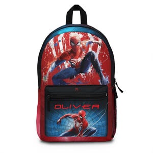 May include: A red and blue Spider-Man backpack with a black handle and zipper. The backpack features a large graphic of Spider-Man in action, with the name "OLIVER" printed on the front pocket.