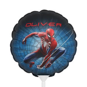 May include: Round Spider-Man balloon with a black border and a blue web background. The superhero is in a dynamic pose, wearing his signature red and blue suit. The name "OLIVER" is printed in red across the top.