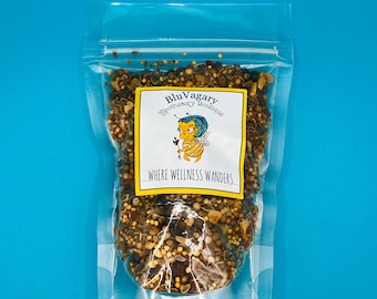 May include: A clear plastic bag filled with a blend of dried herbs and spices. The bag has a label that reads "BluVagary Apothecary Boutique" and "...where wellness wanders..."