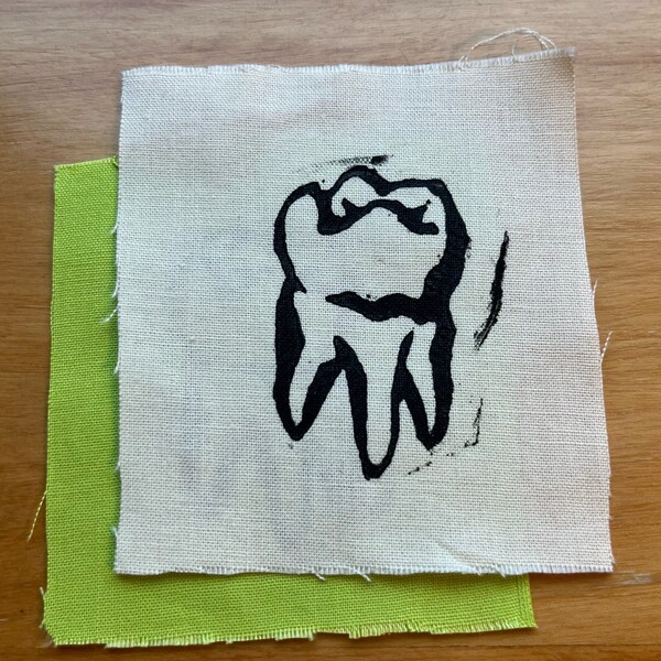 tooth patch, small, filler patch, punk patch, sew on fabric patch. block-printed by hand on repurposed cotton fabric, linocut print.