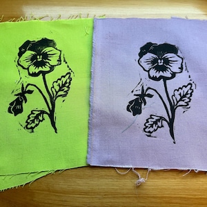 Pansy patch, punk patch, sew on fabric patch. block-printed by hand on repurposed cotton fabric, linocut print.
