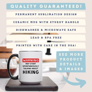 May include: White ceramic mug with a black handle and rim, displaying the text "WARNING MAY START SPONTANEOUSLY TALKING ABOUT HIKING" in black and red. The mug is on a wooden surface. The image also includes text about product features.