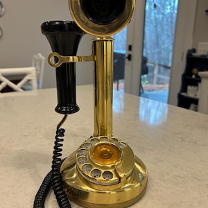 May include: A white ceramic mug with a black handle and the text "But First, Coffee" in a handwritten style. The mug is likely 11-15 ounces, perfect for a morning beverage.