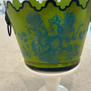 May include: A white ceramic mug with a black handle and the text "But First, Coffee" in a black, bold font. The mug is on a white surface. The mug is 4 inches tall.