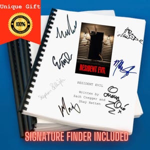 May include: A spiral-bound script for Resident Evil, written by Zach Cregger and Shay Hatten, featuring a central movie poster image and multiple black ink signatures on the white cover pages, with a black plastic binding spine.