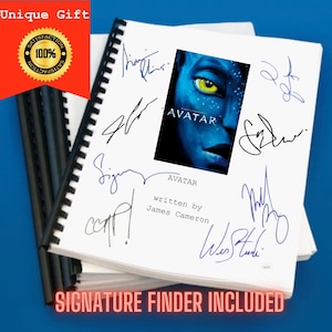 May include: A white spiral-bound script for the film Avatar, written by James Cameron, featuring a central image of a blue Na'vi character with a yellow eye. The cover is decorated with multiple ink signatures in black and blue surrounding the title.
