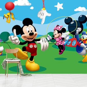 May include: A vibrant cartoon scene featuring Mickey Mouse, Minnie Mouse, Donald Duck, Daisy Duck, and Pluto. Mickey Mouse is in a red shorts and yellow shoes. Minnie Mouse is in a pink polka dot dress. The background is a green field with a blue sky.