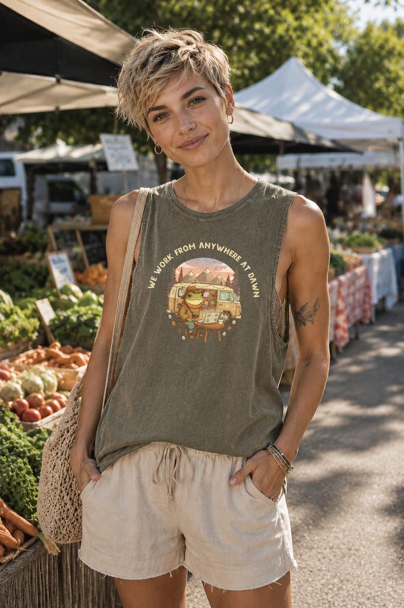 Green graphic tank top with a frog and van illustration and text "We Work From Anywhere At Dawn".