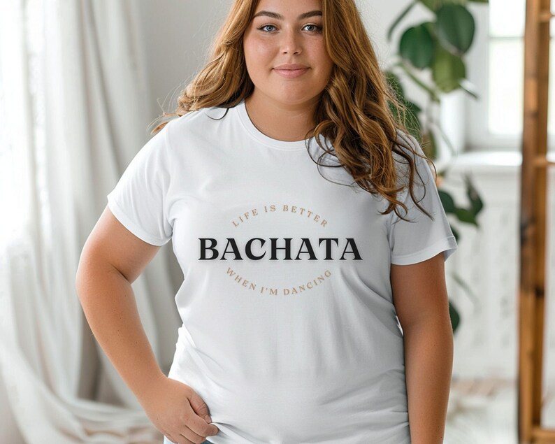 May include: White t-shirt with the text "Life is better when I'm dancing Bachata" printed on the front.