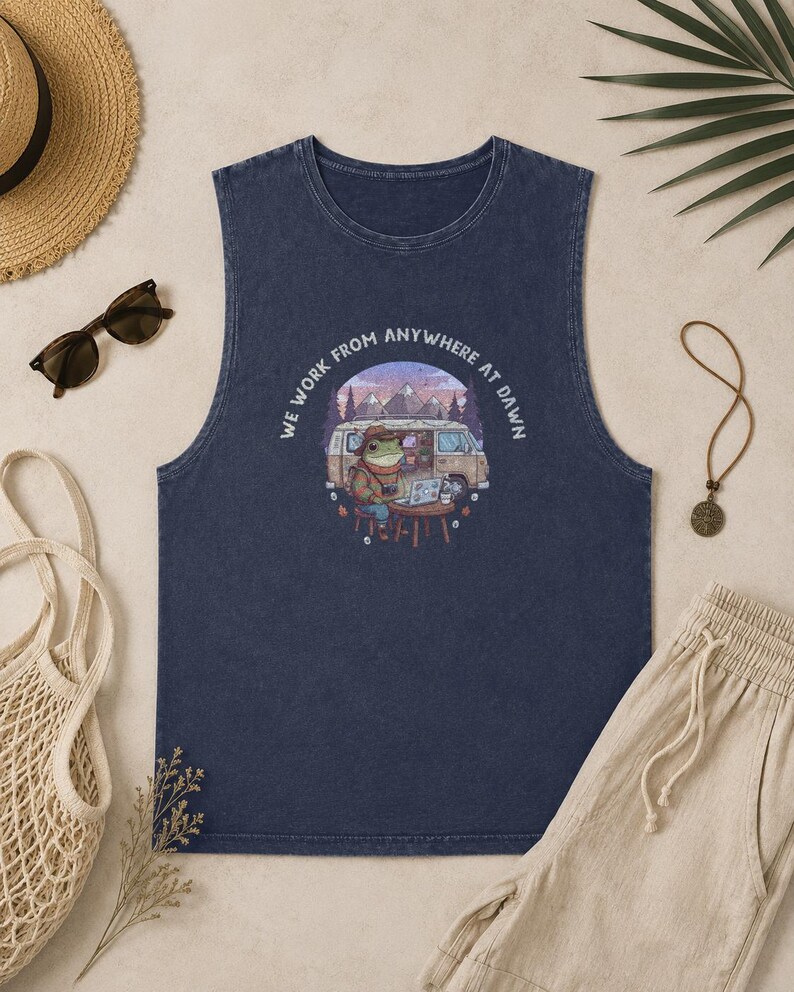 Sleeveless navy shirt with a frog working on a laptop next to a van.