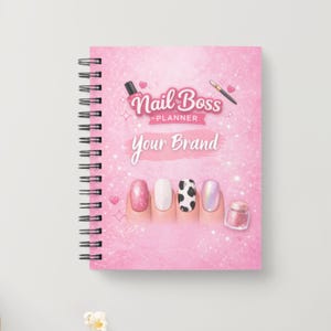 May include: A pink spiral-bound planner with the text "Nail Boss Planner" and "Your Brand." The cover features nail designs and a glitter effect. A nail polish bottle and pen are also shown.